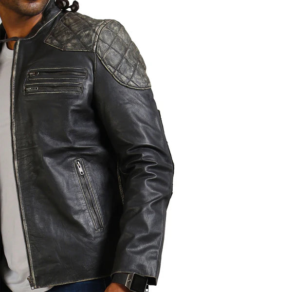 Black leather jacket with quilted shoulder design on a white background